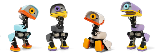 Four Microduck biped robots in Cream, Graphite, Lavender, and Sky colourways